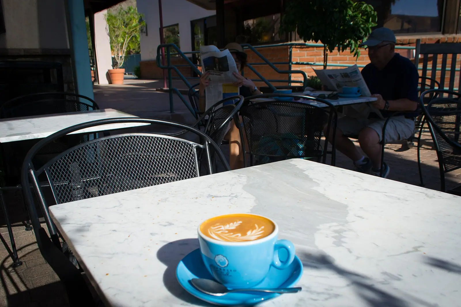 Illustrative photo of a coffee and café table, not of Baker & Cook